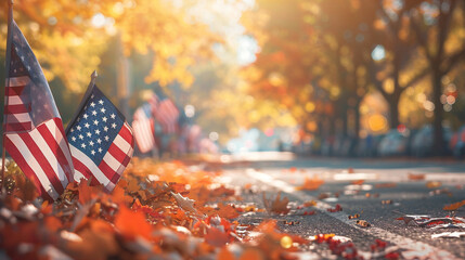 Patriotic autumn background with American flags and fallen leaves in warm colors for Veterans Day or Thanksgiving Day