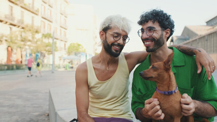 Gay couple spend time together with their dog outdoors