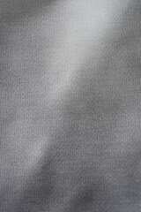 Silver background of aluminum foil. Grey ribbed background.