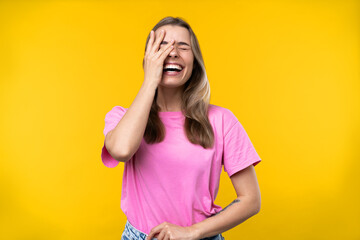 Happy emotions concept. Positive and beautiful young woman laughs in studio
