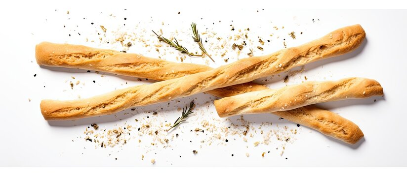 A flat lay image showcasing grissini breadsticks accompanied by olive oil on a plain white background allowing ample space for text