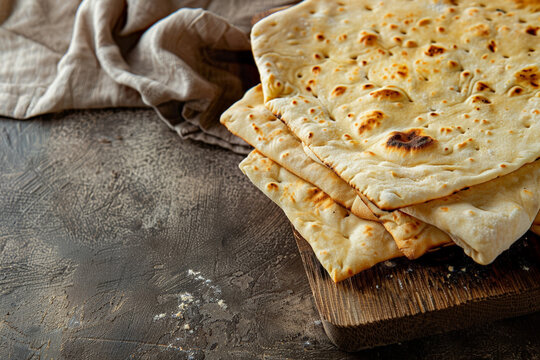 Flatbread on a sandy to earthy gradient background, connecting with themes of tradition and rustic dining 