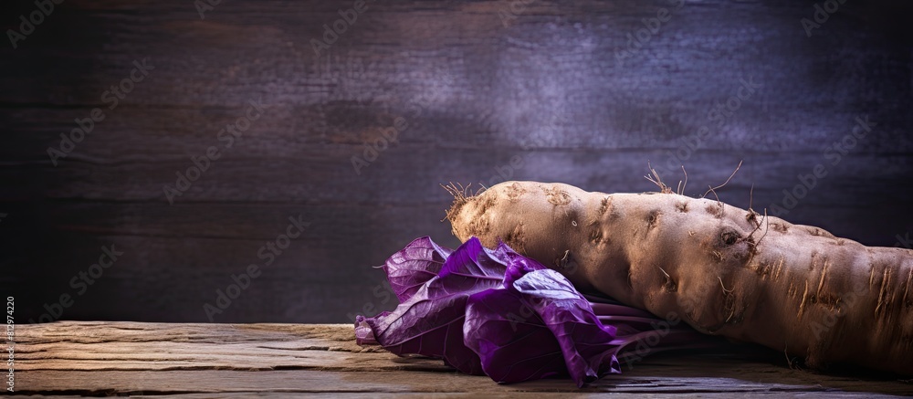 Poster a copy space image of a taro root displayed on a rustic wooden background
