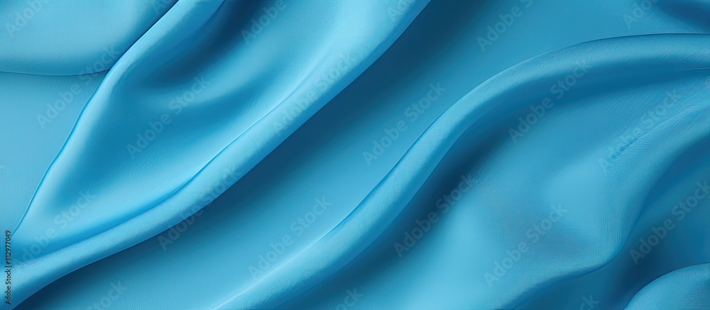 Poster top view of a blue fabric texture background with ample copy space for work and design purposes