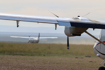 View from behind of a small plane on Kichwa Tembo airstrip