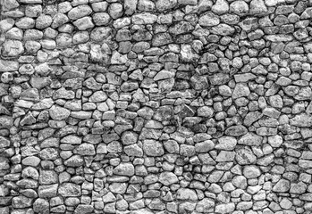 Small stone wall texture for background. Part of a stone wall or pebbles wall, for background or...