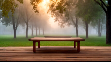 Fototapeta premium Wooden table on the background of the evening foggy park