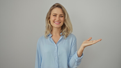 Blonde woman presents with hand against a white background, embodying beauty, youth, and positivity.