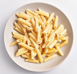 A bowl of cooked penne pasta on a white background, ready for serving or further meal preparation.
