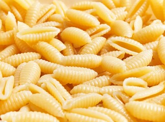 Close-up of uncooked gnochetti sardi pasta filling the frame, ideal for food and culinary concepts.