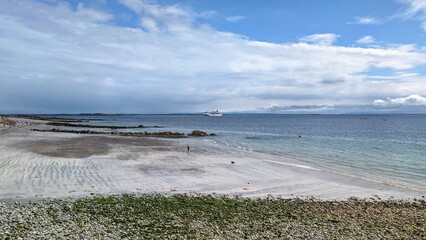Huge cruiser ship anchored near Salthill beach at Galway bay, Ireland, ocean and transportation...