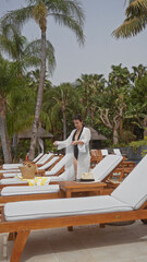 A young hispanic woman enjoys a relaxing day at a bali resort, dressed in a swimsuit with a cover-up.