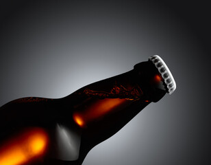 Close-up of an unopened beer bottle.