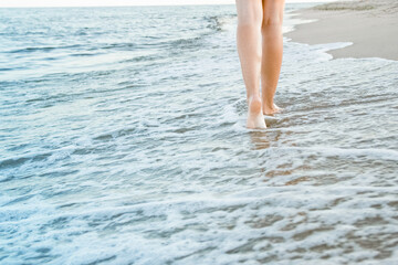 stylish beautiful legs with traces of the sea in the summer on the nature