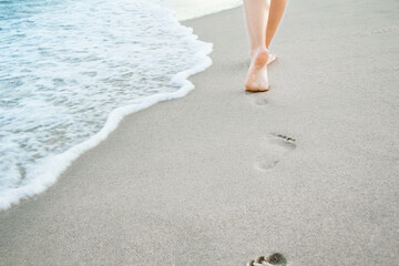 stylish beautiful legs with traces of the sea in the summer on the nature