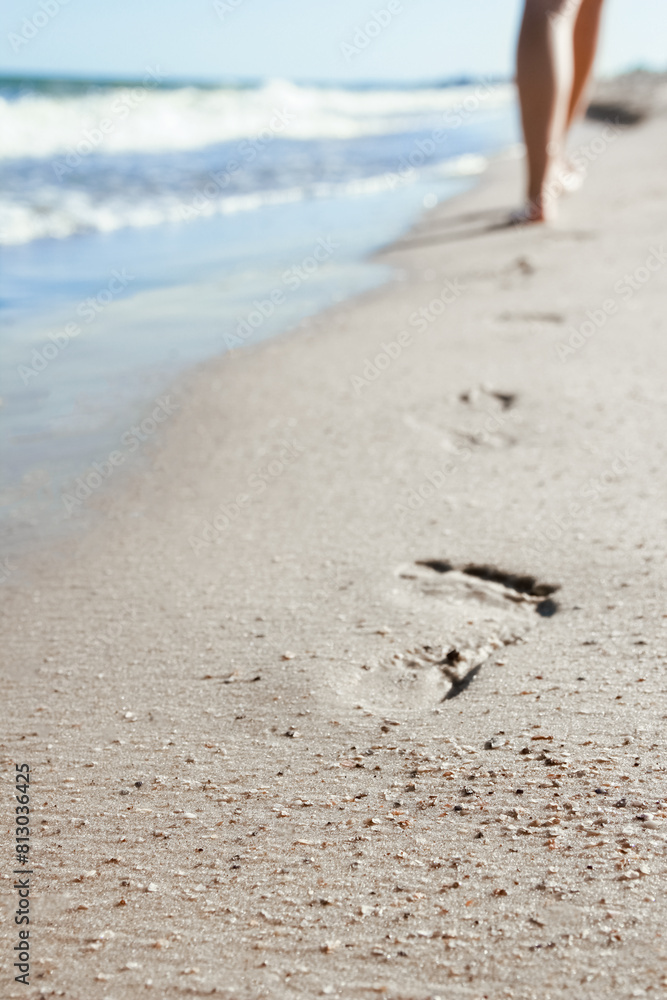 Wall mural stylish beautiful legs with traces of the sea in the summer on the nature