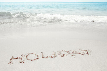 beautiful drawings inscription on the sand of the sea in the summer on the nature