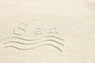 A drawing on the sand by the sea travel background
