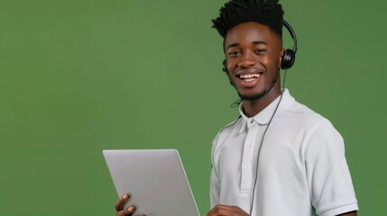 A Smiling Man with Laptop and Headphones