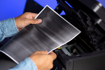 The man repairing laser printer.