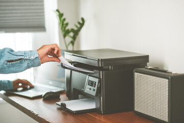 The man using the laser printer.