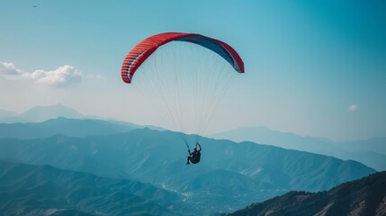 A person paragliding over a mountain range, adventure background