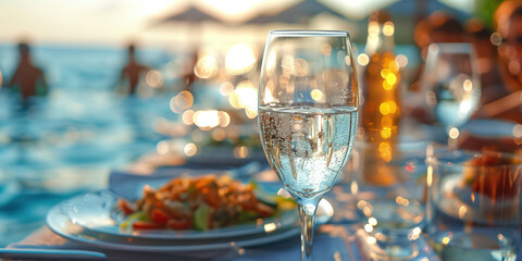 Close-up of family on holiday or vacation eating near a beach a la carte with the blue sea in the...
