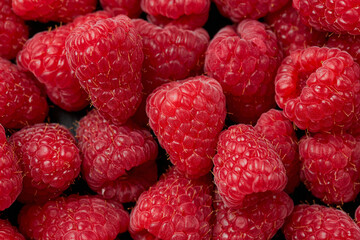 Fresh sweet ripe red raspberries background. Healthy food