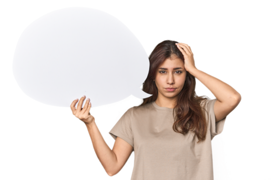 Middle Eastern woman holding comic bubble being shocked, she has remembered important meeting.