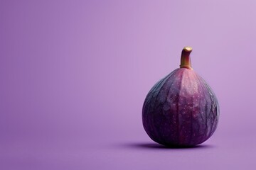 A purple fruit with a stem on top. The purple background is a light purple color with copy space