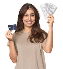 Young Middle Eastern woman comparing credit card and dollars in studio