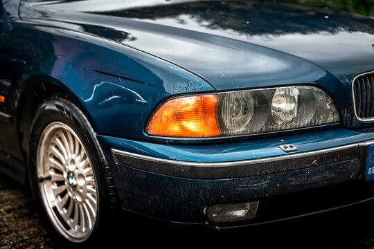Blue BMW E39 parked outdoors