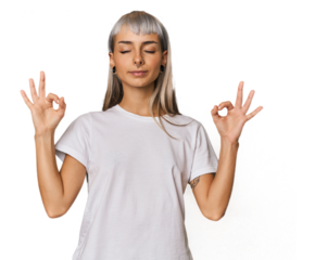 Young caucasian young woman in studio relaxes after hard working day, she is performing yoga.