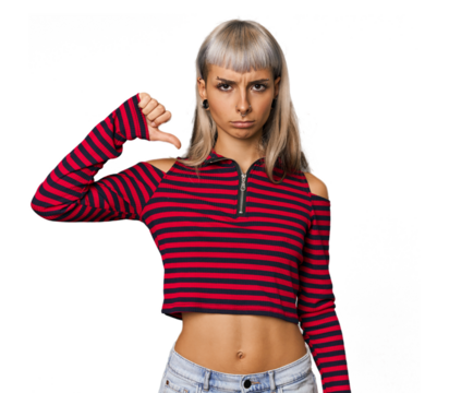 Young caucasian young woman in studio showing a dislike gesture, thumbs down. Disagreement concept.