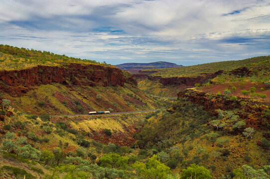 Road train on the Great Northern Highway in Karijini National Park, Western Australia. The highway winds through the spectacular Munjina Gorge	