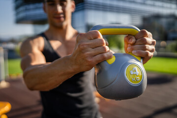 One man young adult caucasian male train with kettlebell girya weight