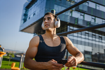 One man caucasian young male stand at outdoor open training park gym