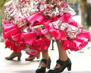 Closeup of spanish Flamenco dancers women wearing typical skirt with ruffles and shoes