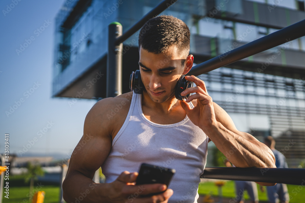 Canvas Prints man young male use mobile phone at outdoor open training park gym