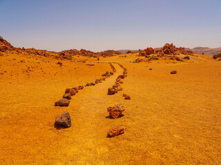 spot in Tenerife with many red rocks and beautiful mountain landscape background