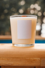 Scented candles on a wooden table. 