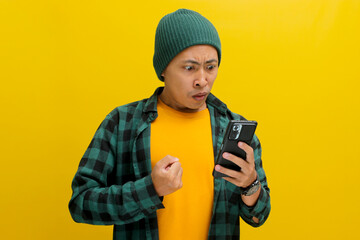 An angry Asian man, dressed in a beanie hat and casual shirt, visibly reacts to bad news while...