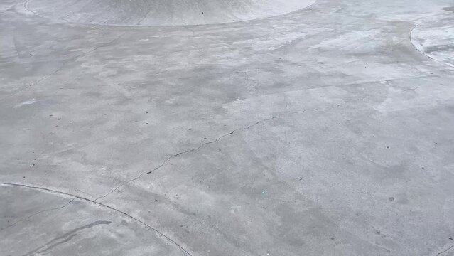 Public playground for a skateboard in a recreation park. No people.