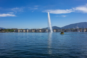 Beautiful view of the water Jet Fountain (Jet d'Eau fountain, 140 meters) in the lake of Geneva (Lac Leman). GENEVA, SWITZERLAND.