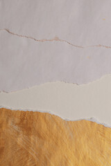 Gold, bronze and beige paper paper torn frame painting wall. Abstract glow texture copy space relief background.