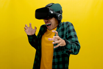 Terrified Asian man wearing a VR headset screams in fear while experiencing a horror movie in VR....