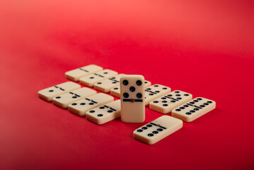 Dominoes with red background, copy space and various angles.