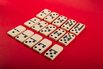 Dominoes on a red background.