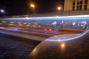 Lesser Town in Prague by night. Evening public transportation. Motion blurred tram. Prague, Czech Republic