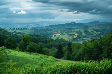 Obraz premium photograph of green hills and fields with trees, clouds in the sky, dark blue mountains in the background, hills of the Emiliauso region of Italy, in the style of Emira di Pissiwave, detailed landscap